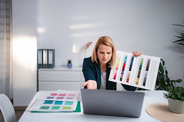 istock Woman presenting color palette during video call at home office 2247143209