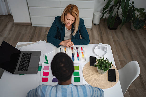 istock Two women discussing creative design choices using color palettes 2247143380