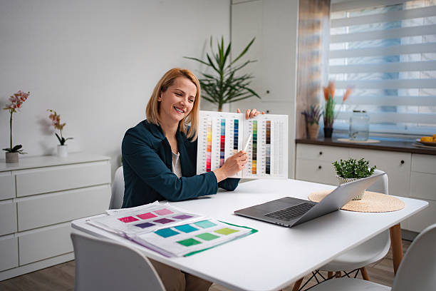 istock Woman showing color palette during remote video call 2247143439