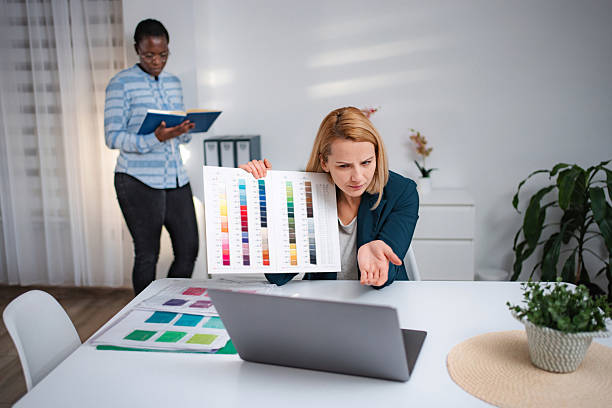 istock Woman expressing confusion during video call holding color palette 2247143453