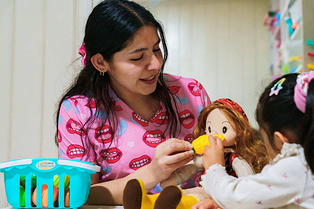 istock Latin american speech therapist playing with child during therapy 2247143870