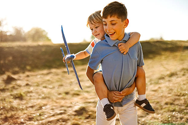 istock Two brothers are playing with airplanes. 2247144044