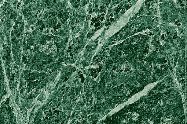 istock Real closeup of dark green marble stone texture surface background. Design pattern with high resolution for luxury home decoration. Abstract matt slab rock material. Front view of natural tiles stone surface. 2247144796