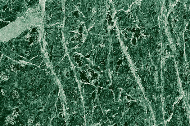 istock Real closeup of dark green marble stone texture surface background. Design pattern with high resolution for luxury home decoration. Abstract matt slab rock material. Front view of natural tiles stone surface. 2247144801