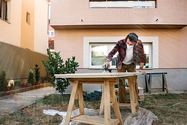 istock Man prepares a door for painting 2247145502