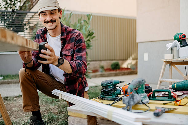 istock Man prepares a door for painting 2247145537