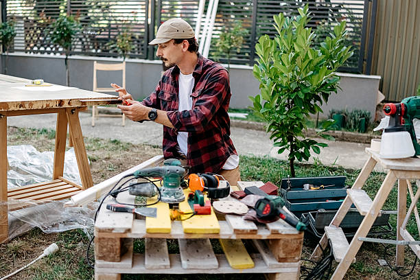 istock Man prepares a door for painting 2247145541