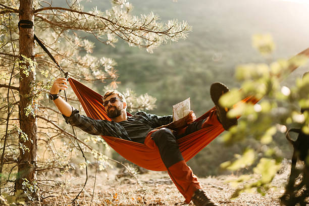 istock Happy adult man resting in hammock 2247146889
