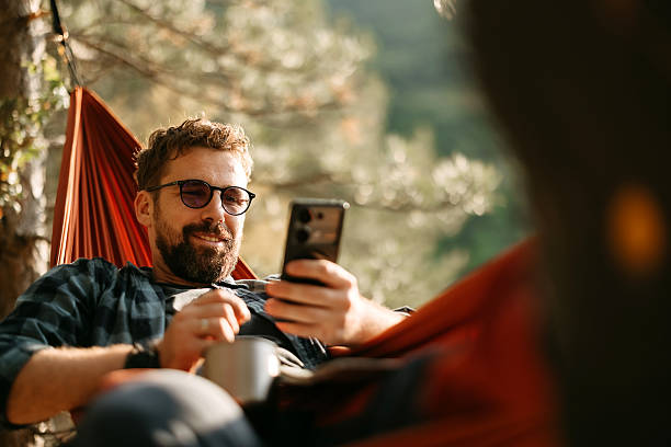 istock Happy adult man resting in hammock 2247146895