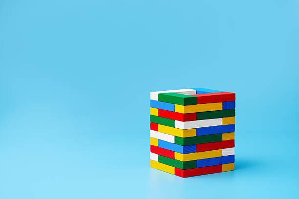 istock Inclusive harmony and balance with color block tower on blue, copy space. 2247147146