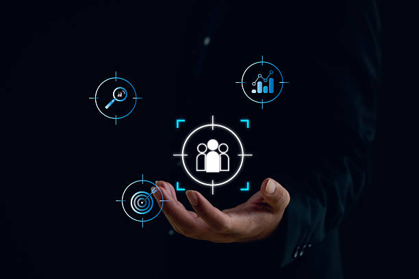 istock Business and digital marketing concept showing customer targeting, audience analytics, and data-driven strategy. A businessman holds icons representing market insight and performance optimization. 2247147196