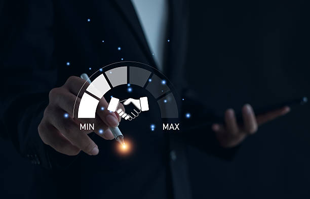 istock Businessman using digital technology for partnership success. Hand holding stylus with handshake icon and performance meter gauge from MIN to MAX, symbolizing trust, collaboration, business growth. 2247147203