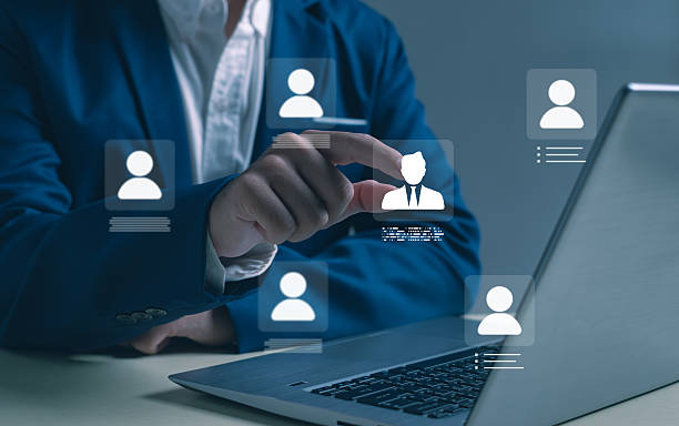 istock Digital recruitment and human resource management concept with businessman selecting candidate icon on laptop, innovation in hiring, employee data analytics, and online talent acquisition technology. 2247147237