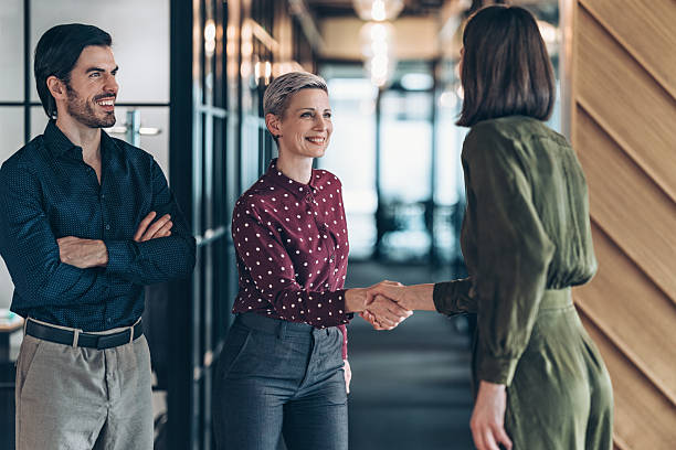 istock Smiling businesswoman greeting a client in a office space 2247150655