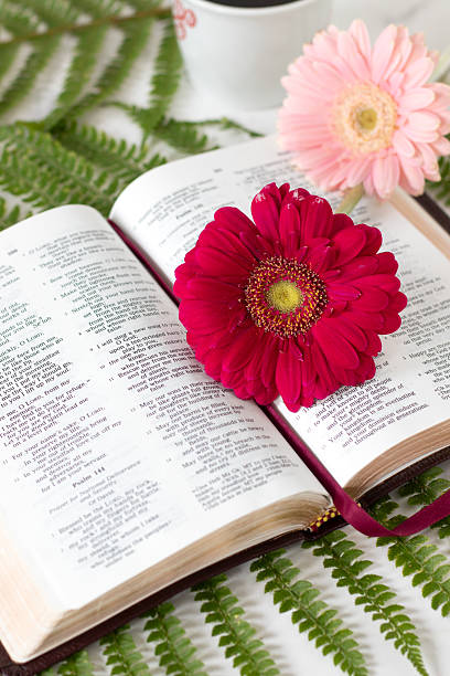 istock Open holy bible with flowers and coffee cup 2247152840