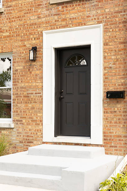 istock A black front door detail on a brick home. 2247155091