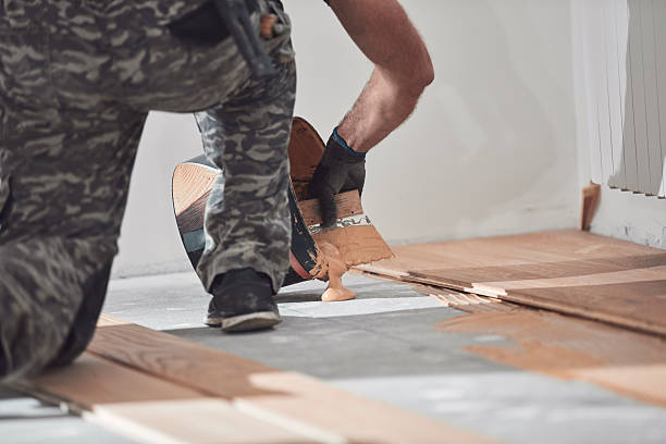 istock Professional handyman installing laminate flooring in a new apartment. 2247155804
