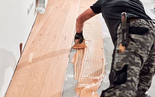 istock Professional handyman installing laminate flooring in a new apartment. 2247155860