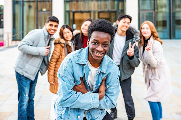 istock Diverse group of smiling young adults posing outdoors 2247156073