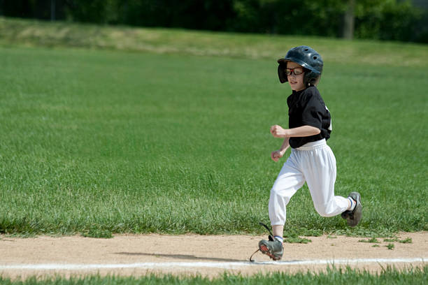 School girl in baseball glove catching a ball. Sports and youth lifestyle concept.