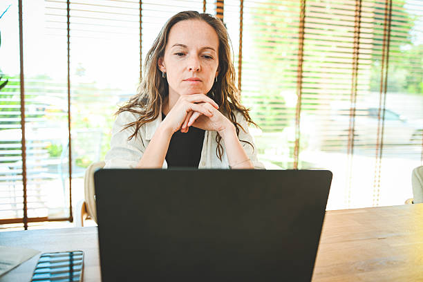 istock woman working on a laptop in an office 2247156112