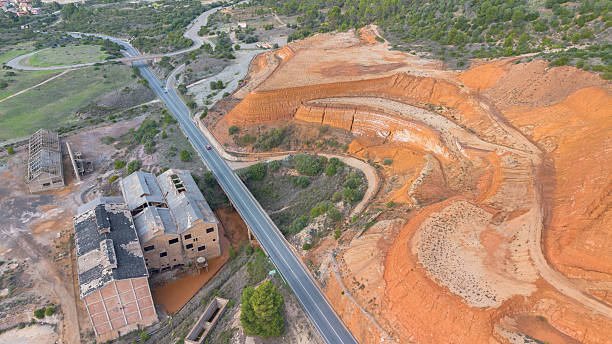 istock Ruins of the Monteponi Mining District with Red Waste Deposits 2247157311