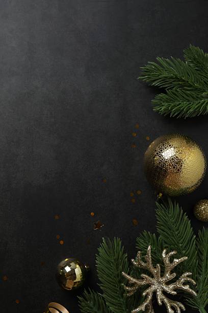 istock Festive Christmas flat lay with decorations on a dark background. View from above, vertical composition 2247158231