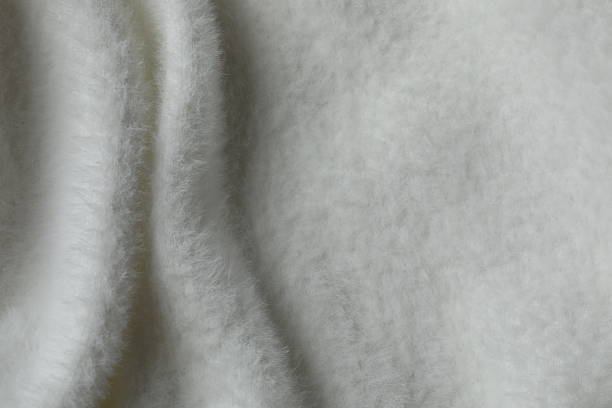 istock Top view of white cashmere fabric background 2247158308