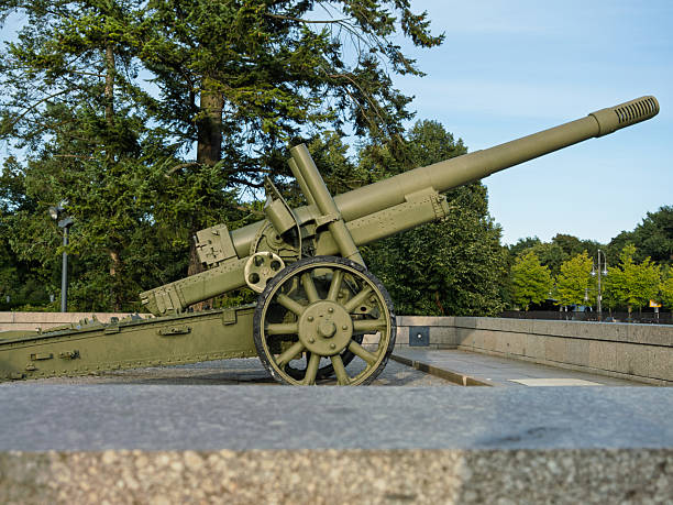 istock Historic Green World War Two Era Artillery Cannon On Low Stone P 2247162049