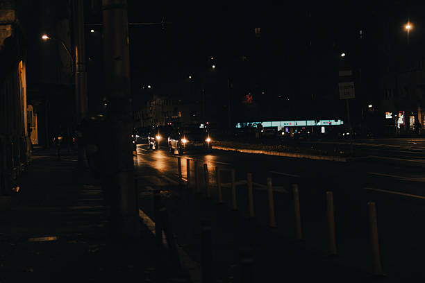 A captivating city night scene showcasing beautifully illuminated buildings and glowing streetlights, vividly reflecting the vibrant urban life that comes alive after dark