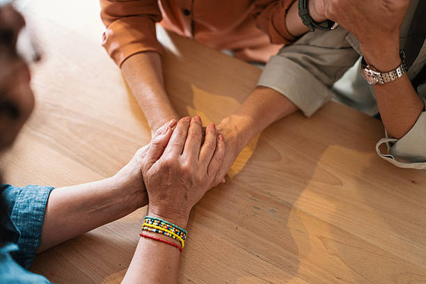 istock Mature Friends Offering Compassion to a Woman Experiencing Emotional Difficulty 2247166864