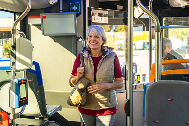 istock Senior woman commuting happily on public transit 2247168062