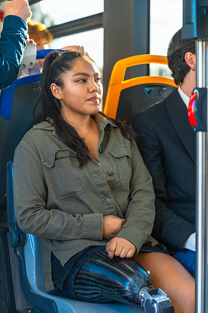 istock Woman with prosthetic leg commuting on public bus 2247168160