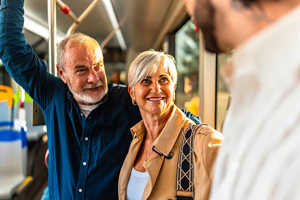 istock Senior couple traveling on urban bus talking 2247168526
