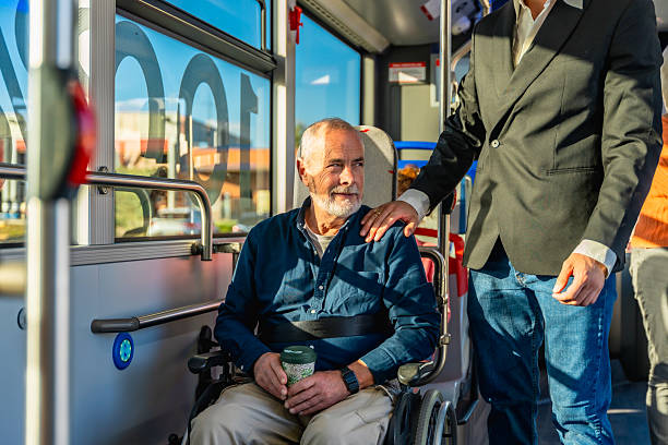 istock Son supporting senior father traveling on public bus 2247168625