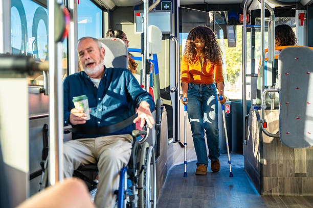 istock People with disabilities riding public transportation bus 2247168704