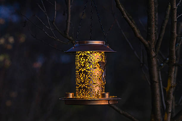 istock bird feeder lantern illuminated cozy evening garden bronze decor outdoor light 2247170494