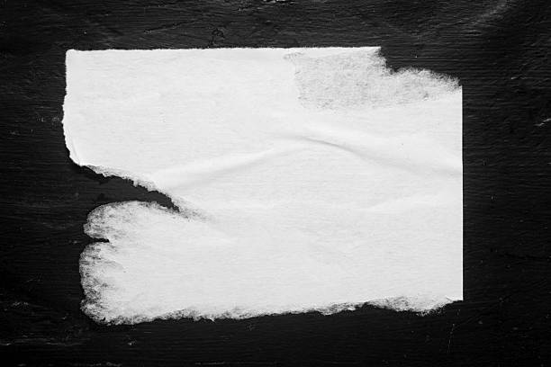 istock A close-up of a torn white poster without any inscriptions 2247172636
