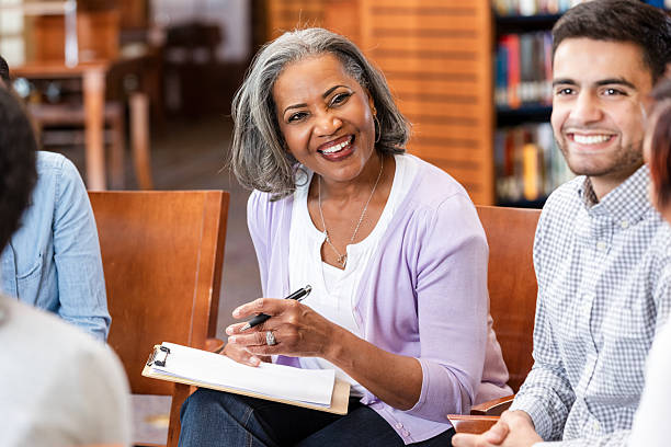istock Diverse group in discussion during a therapeutic session, focused on emotional support and connection 2247174174