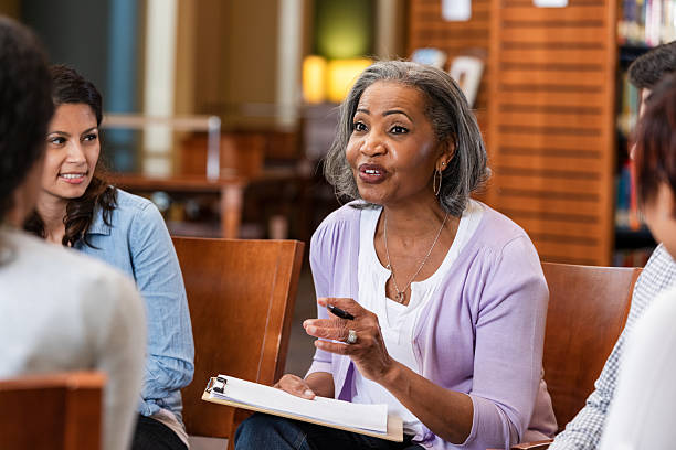 istock Support group session fostering open communication and emotional healing among diverse individuals. 2247174177