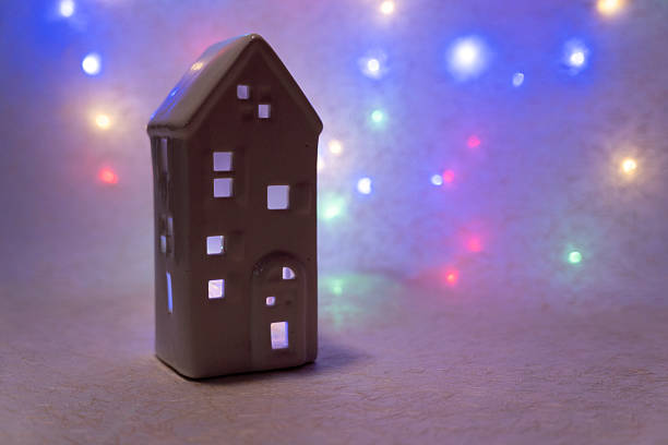 istock Ceramic house glowing with warm light, creating a festive holiday atmosphere, celebrating Christmas decoration and coziness 2247175155