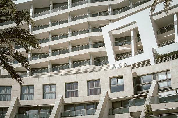 Sesimbra, Portugal, March 3rd, 2024: Modern Luxury Living in Sesimbra: Elegant White Facade with Palm Trees