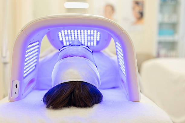 istock Man undergoing  Light therapy in beauty salon. Omega Light Therapy 2247177213