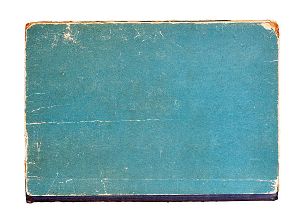 Old vintage book cover with distressed blue surface and worn edges. Concept of retro nostalgia, aged texture or vintage educational material, copy space stock photo