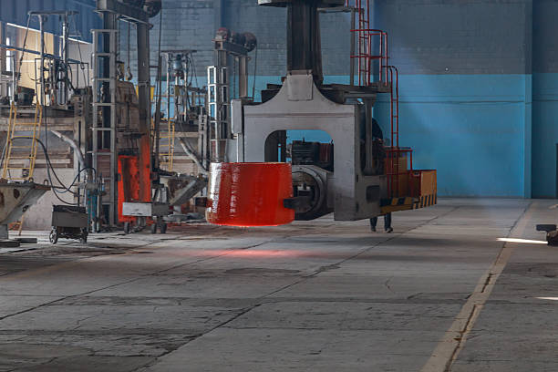 istock A factory workshop where furnaces melt optical glass. 2247177802