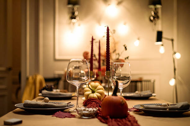 istock Thanksgiving Table Setting Featuring Candles and Pumpkins for Friends 2247178834