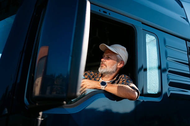 istock Truck driver looking out window, taking break from driving 2247182036