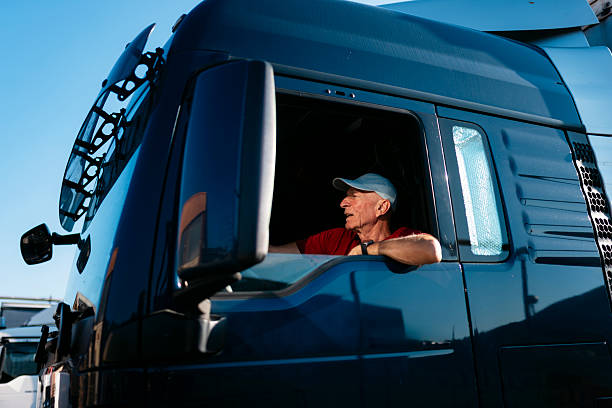 istock Senior truck driver operating heavy vehicle on road 2247182054