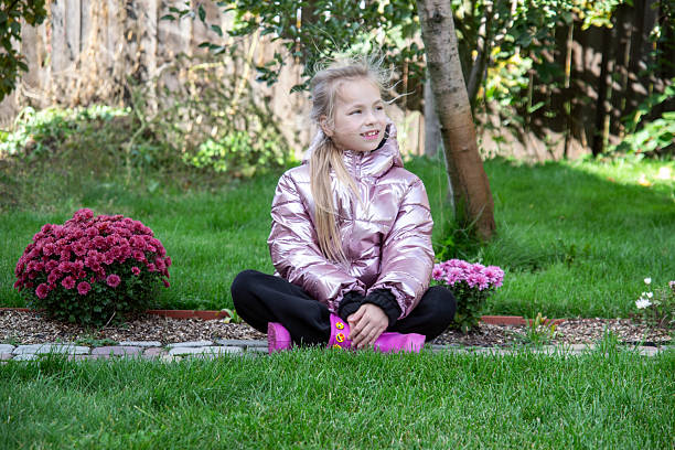girl in an autumn garden with chrysanthemums