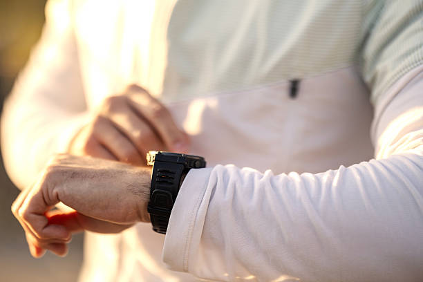istock Man checking time on his digital wrist watch 2247183095